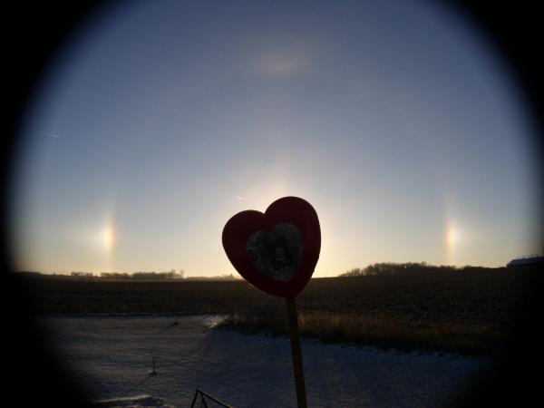 Sundogs and a sun halo.