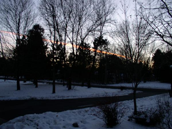 The setting sun illuminates these thin band of clouds nicely