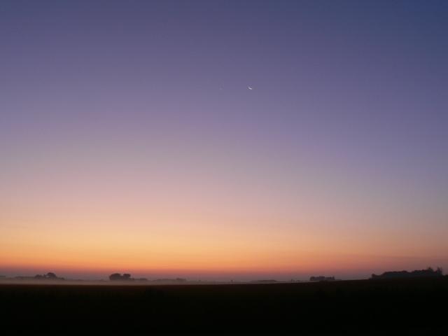 Venus/crescent moon conjunction and morning fog at sunrise.