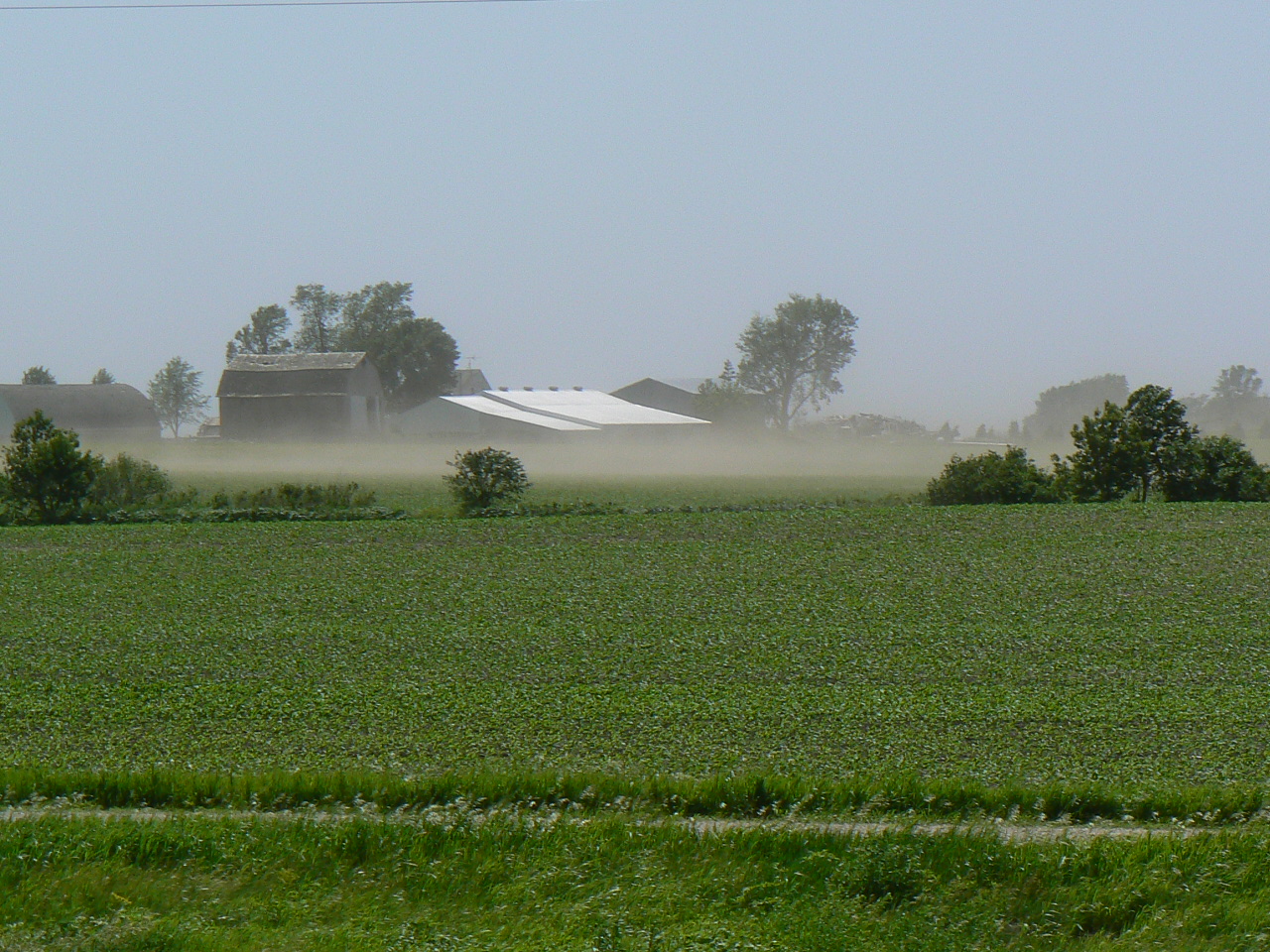 Strong winds and dust from bare fields.