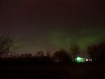 The light on an airport out building reflects the green from the sky. As a whole, this auroral display was unremarkable.