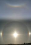 A sun halo, sundogs and a circumzenithal arc. More photos in the sun album.