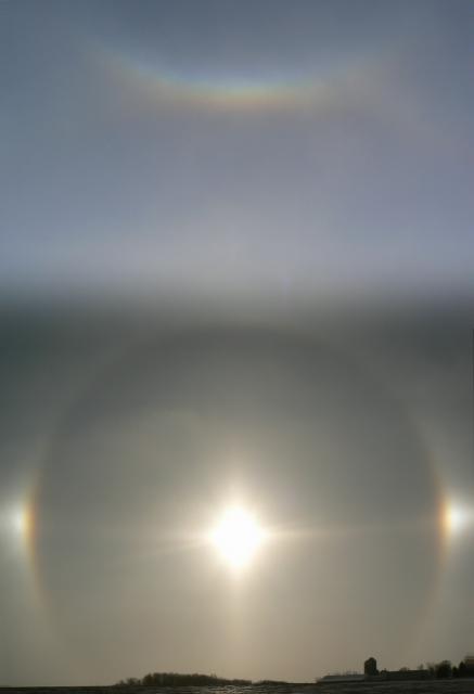 A sun halo, sundogs and a circumzenithal arc. More photos in the sun album.